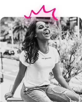 Casava woman with pink crown smiling